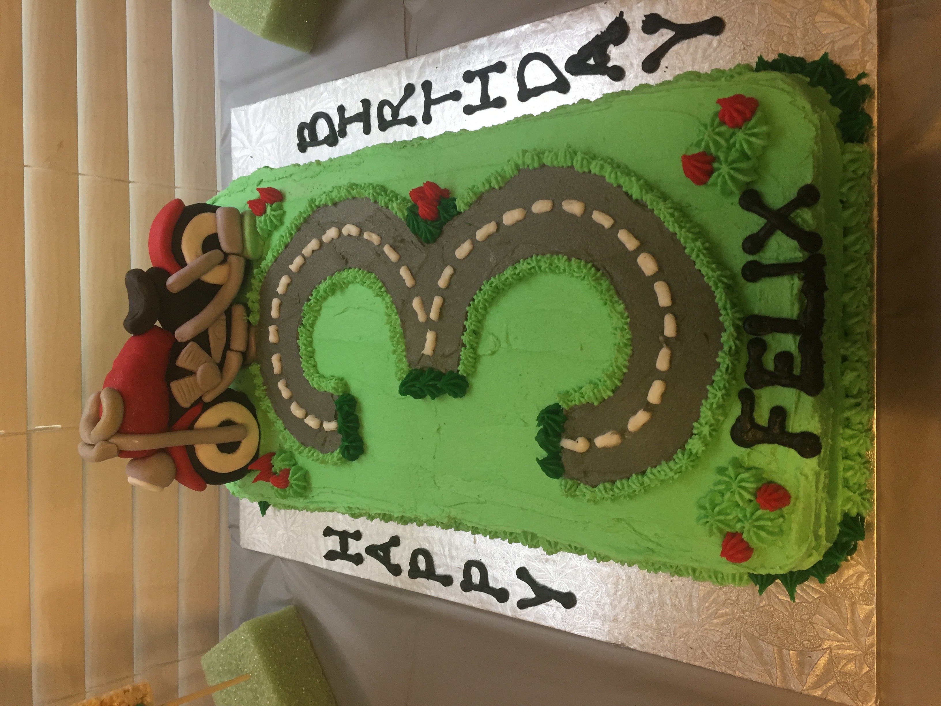 Number 3 shaped birthday cake with motorcycle