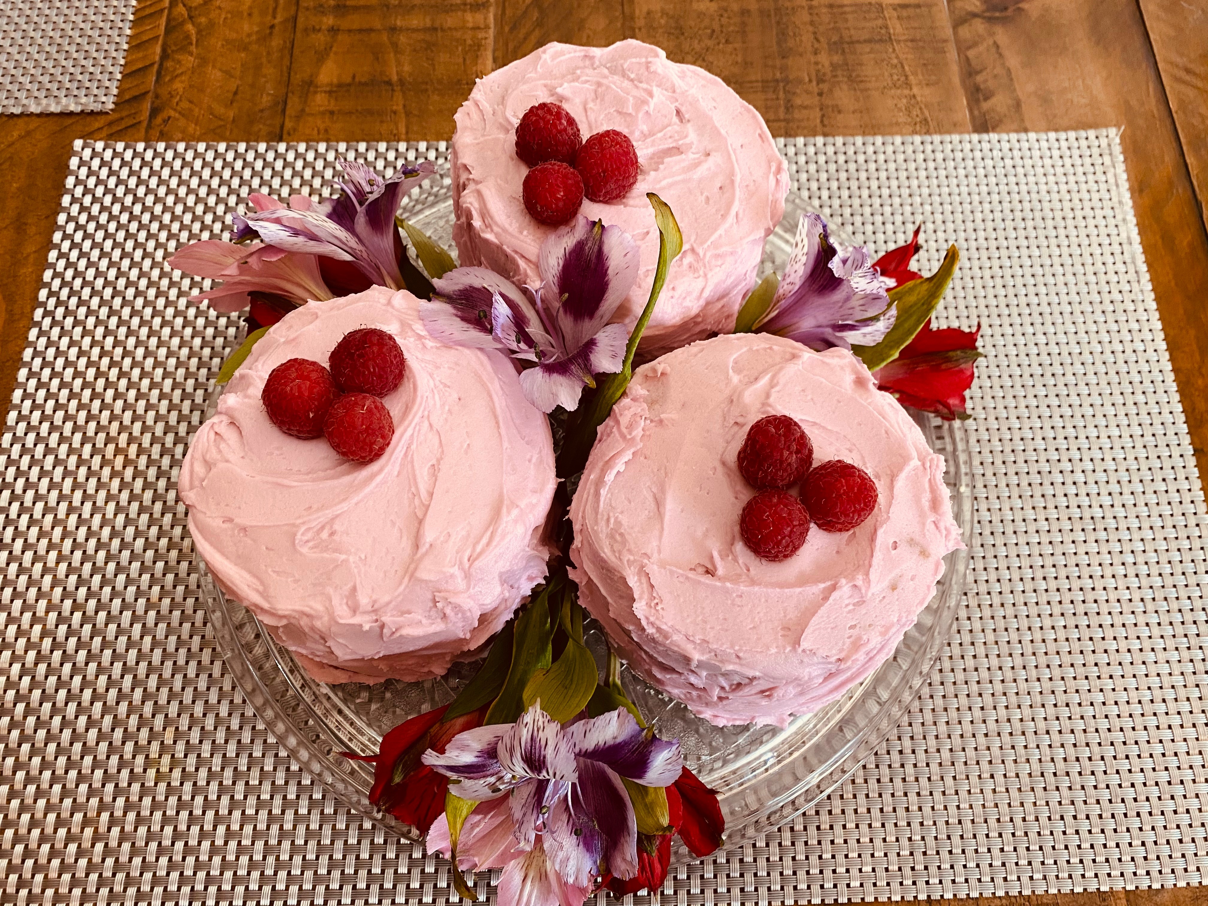 Pink mini cakes with fresh raspberries